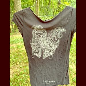 Black shirt with butterfly.